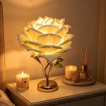 Rose-themed table lamp with white and pink petals
